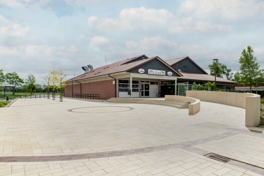 Garrel (D), School and sports center, Umbriano Granite beige, textured.