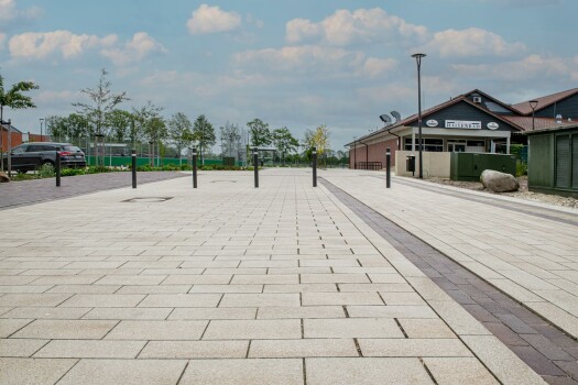 Garrel (D), School and sports center, Umbriano Granite beige, textured.