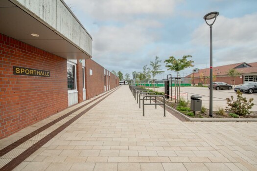 Garrel (D), School and sports center, Umbriano Granite beige, textured.